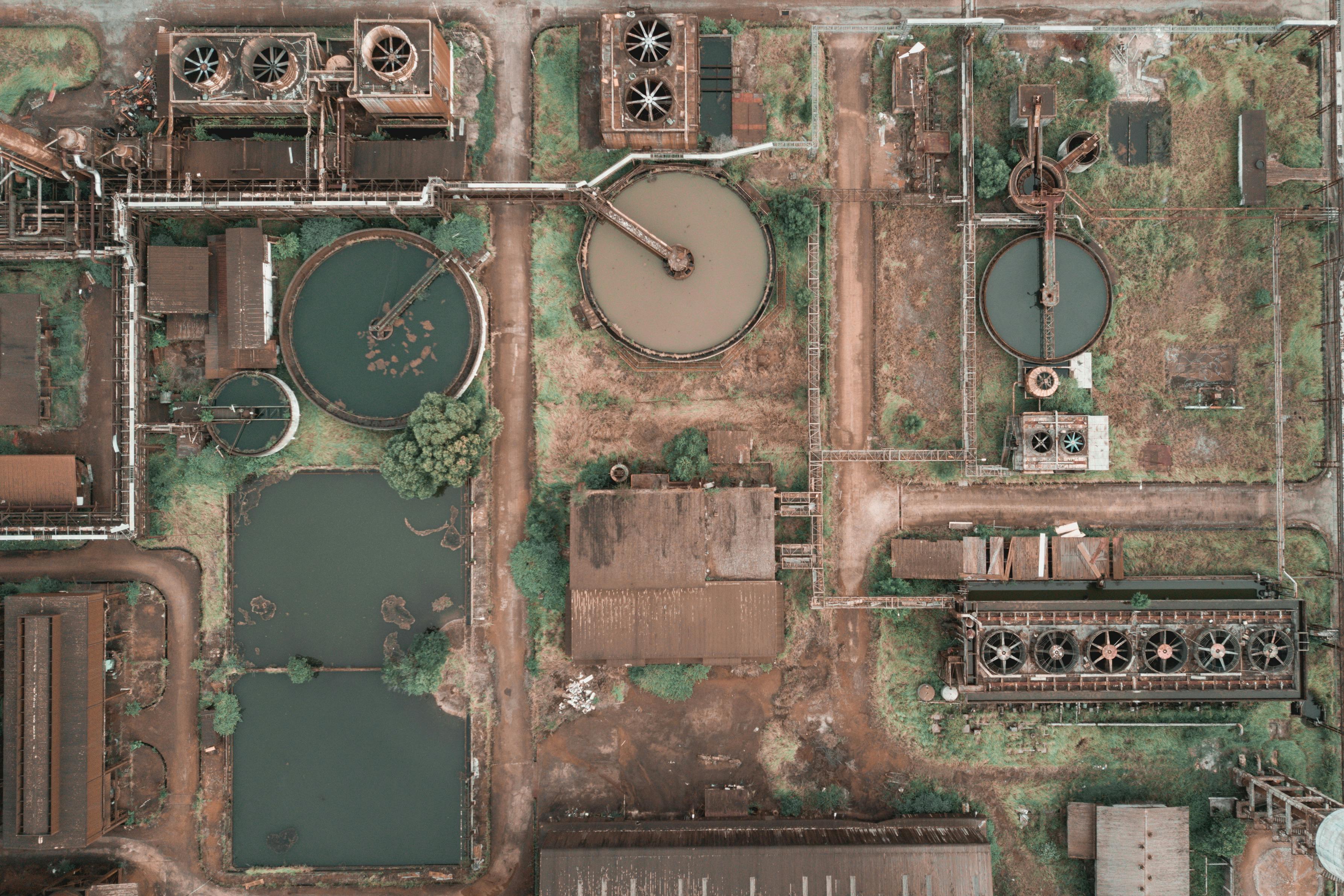 Aerial view of an industrial water treatment plant showcasing clarifiers and tanks.